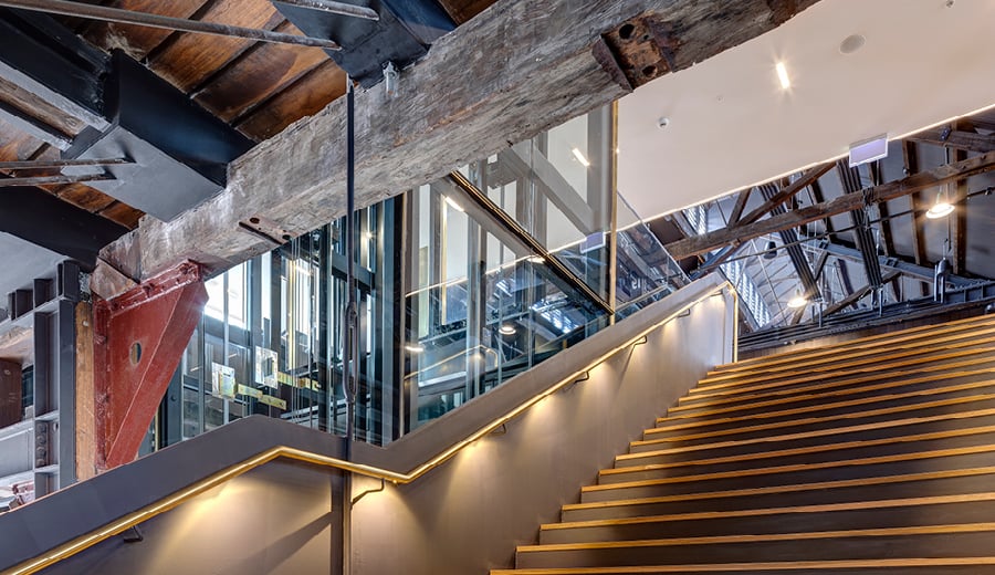 Inside a restored timber and steel building at Walsh Bay Arts Precinct, at Sydney Harbour. The modern fit out is built as an arts and culture venue.