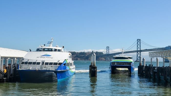 Two ferries docking and leaving their port