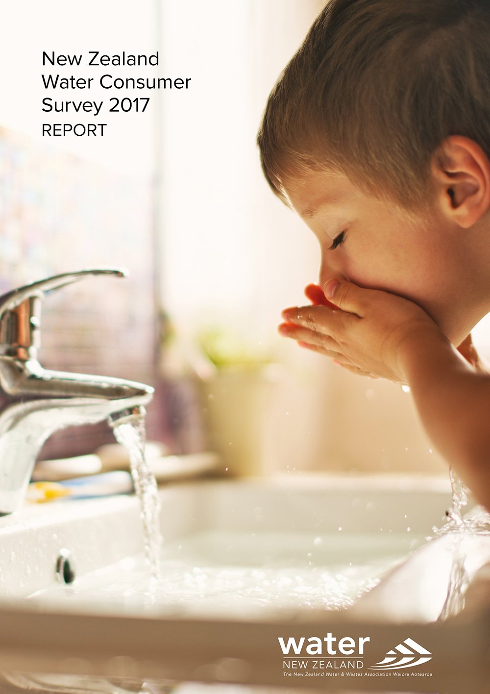 Boy drinking water from tap on cover of NZ Water Consumer Survey
