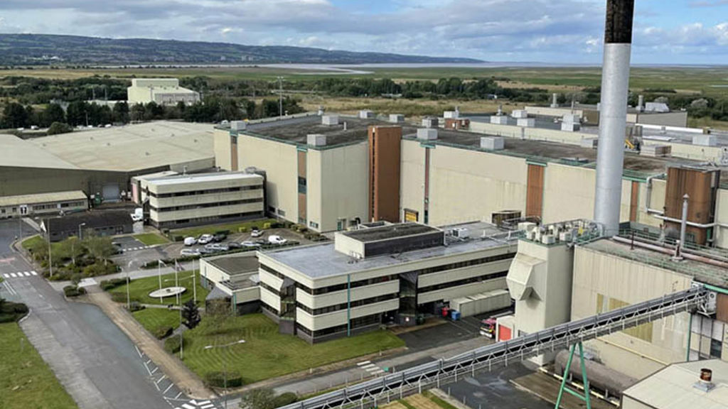 A large factory with a tower.