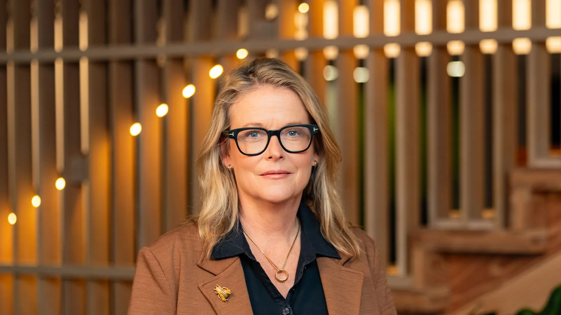 A woman wearing glasses.