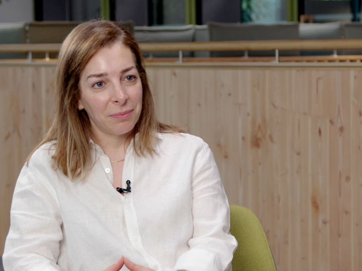 A woman sitting in a chair.