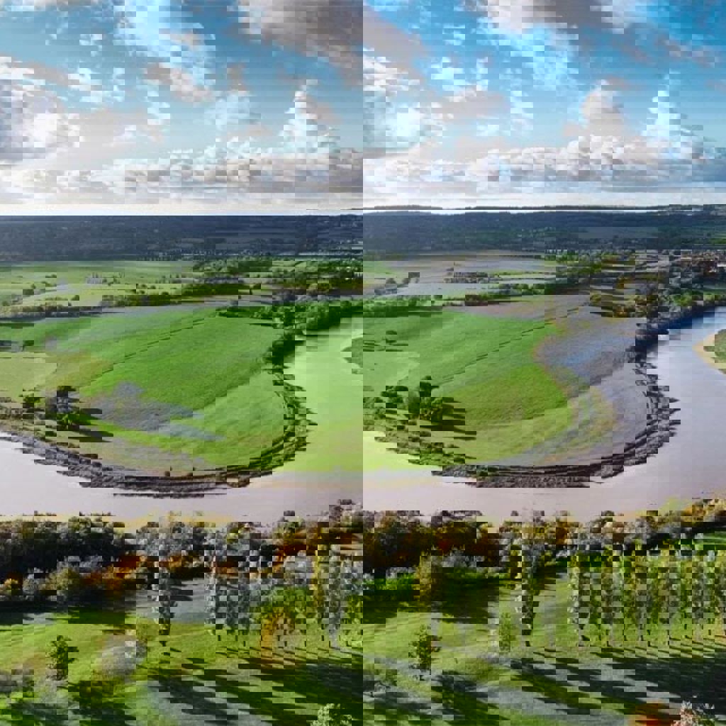 The Avon river running through a green landscape