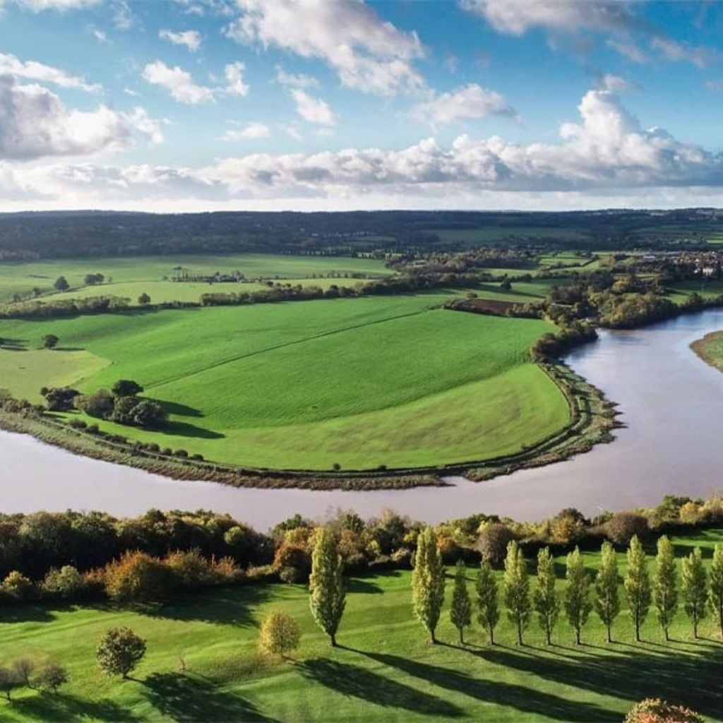 The Avon river running through a green landscape