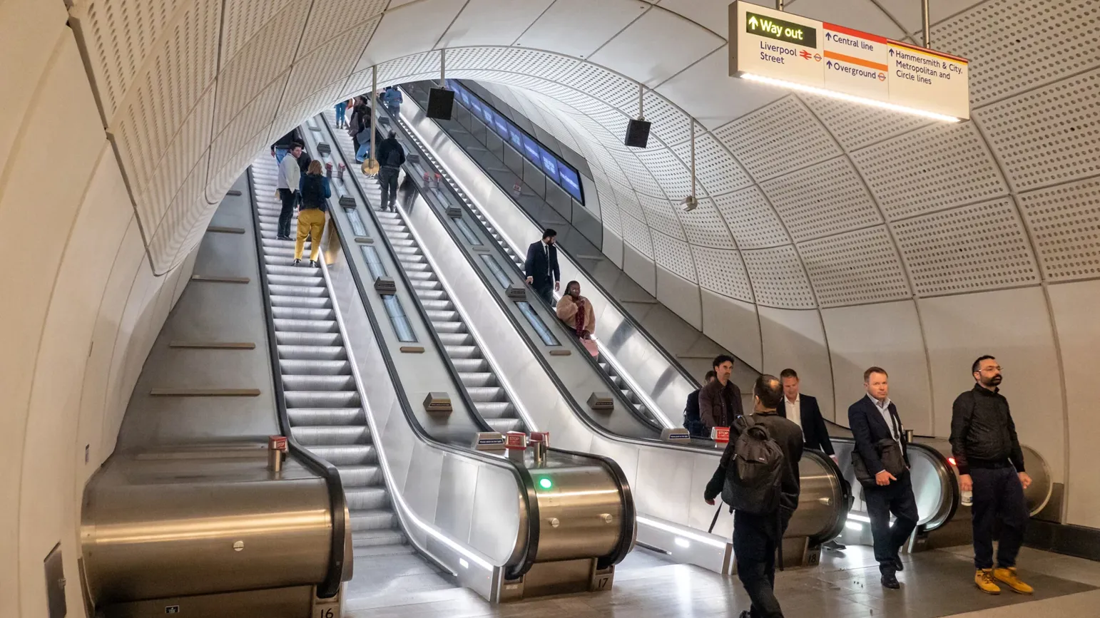 People in an Elizabeth Line station, London