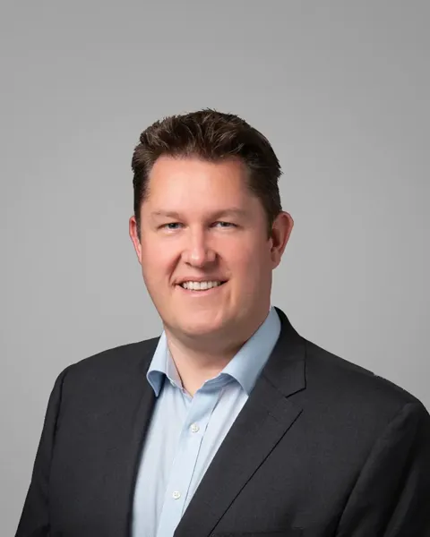 A man smiling for the camera.