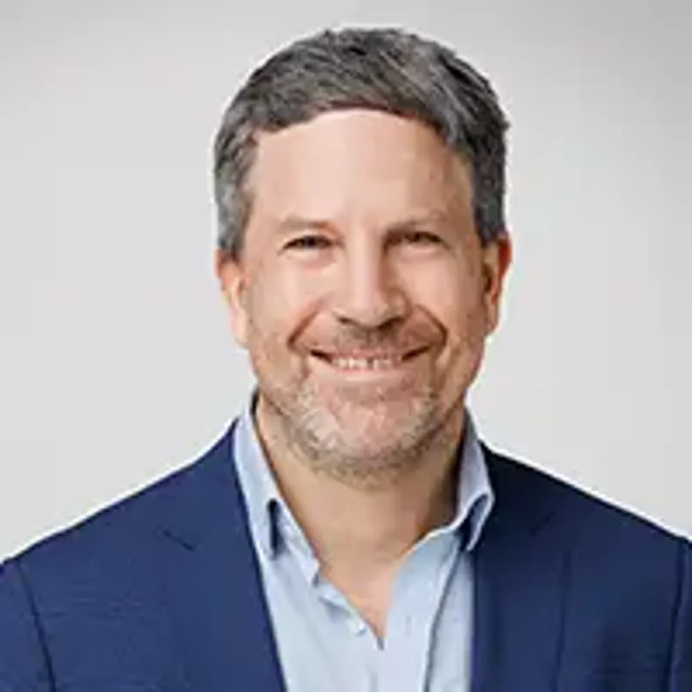 A man in a blue shirt.