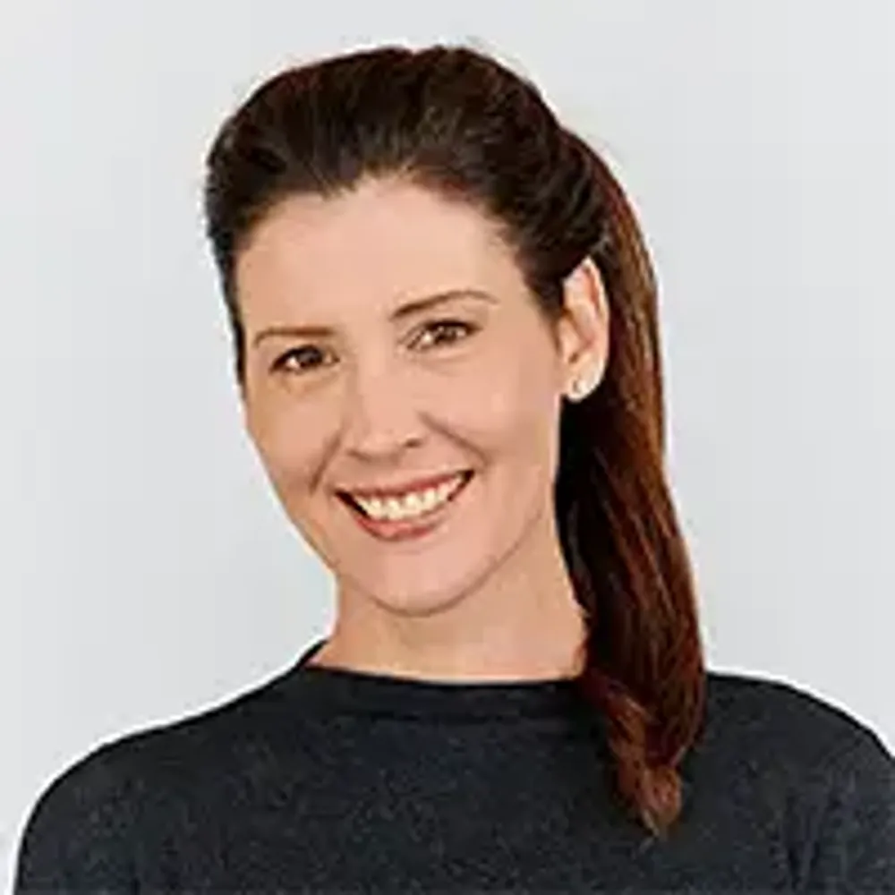 A person smiling for the camera.