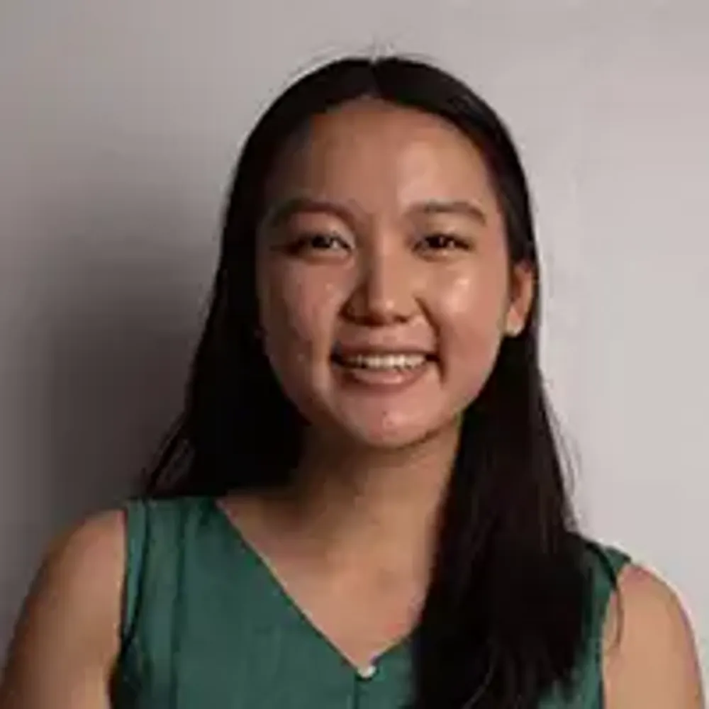A woman smiling for the camera.