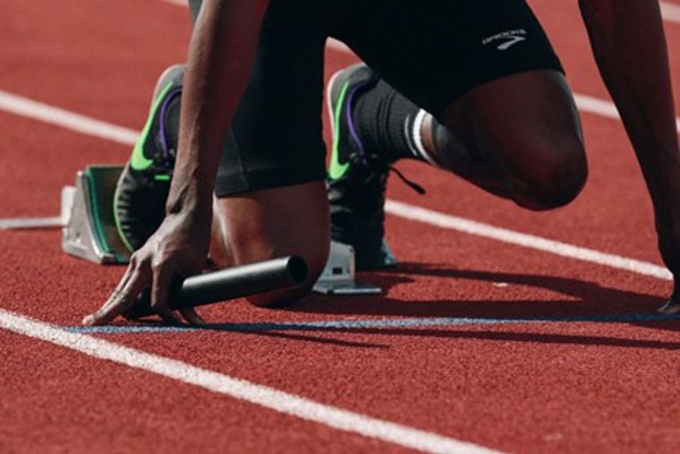 A person running on a track.