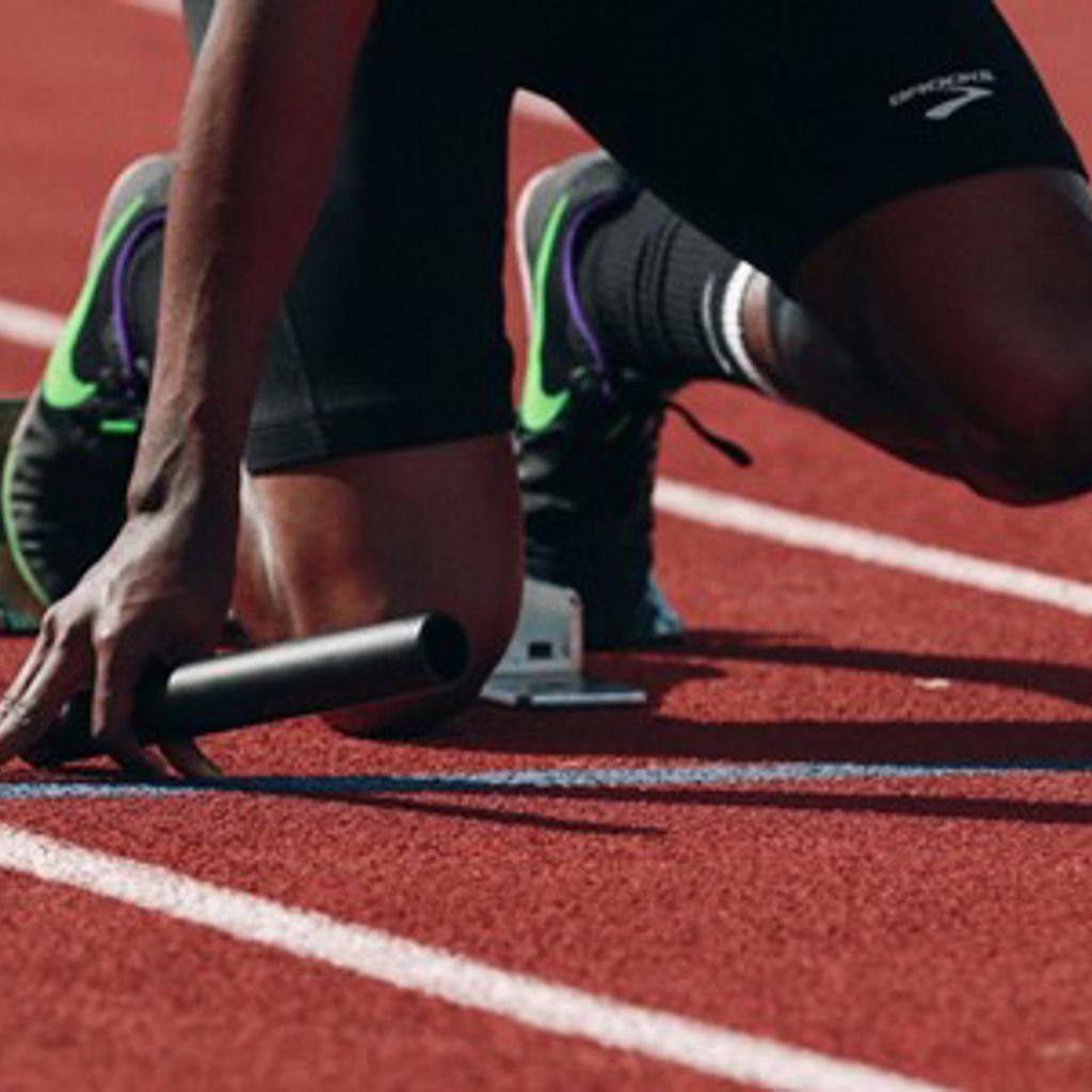 A person running on a track.