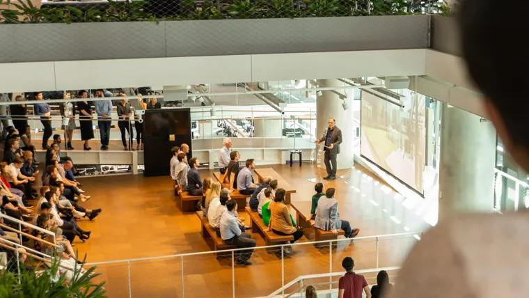 A group of people sitting in a room.