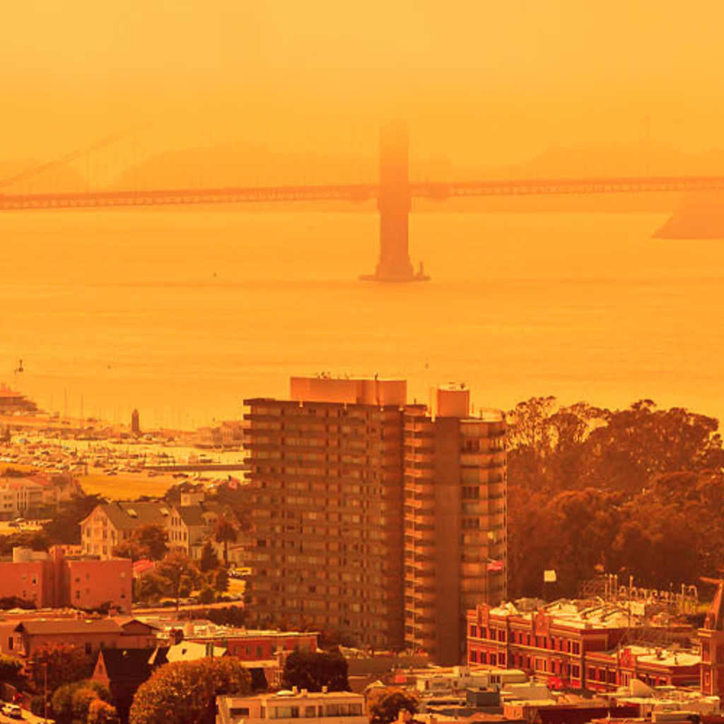 A view across a city in an orange hue