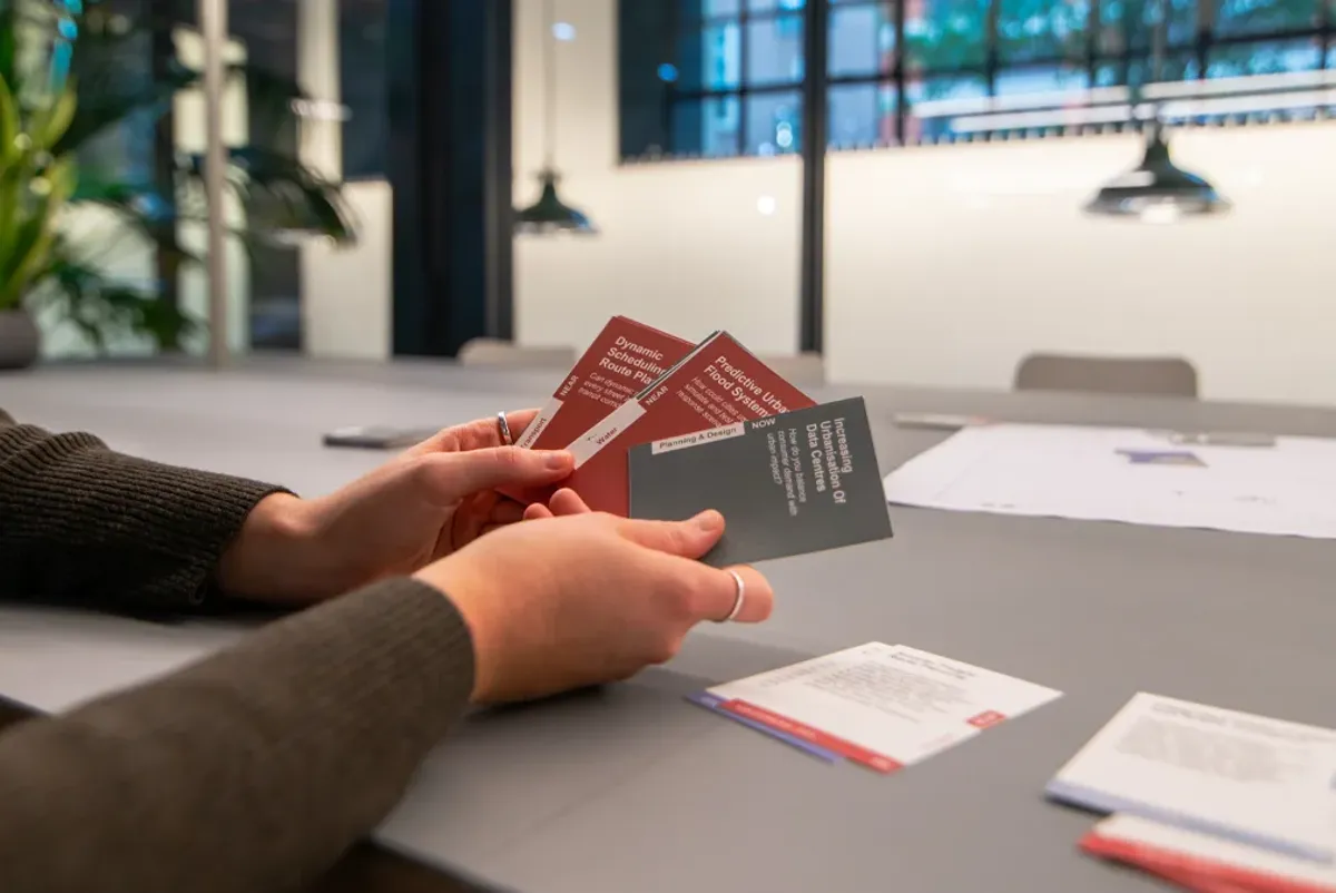 A few hands holding books.