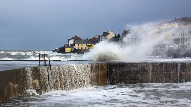 Waves crashing against a wall.