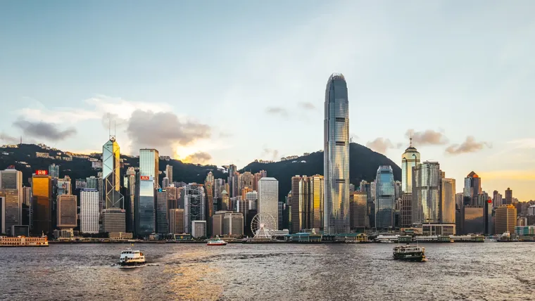 A city skyline with boats.