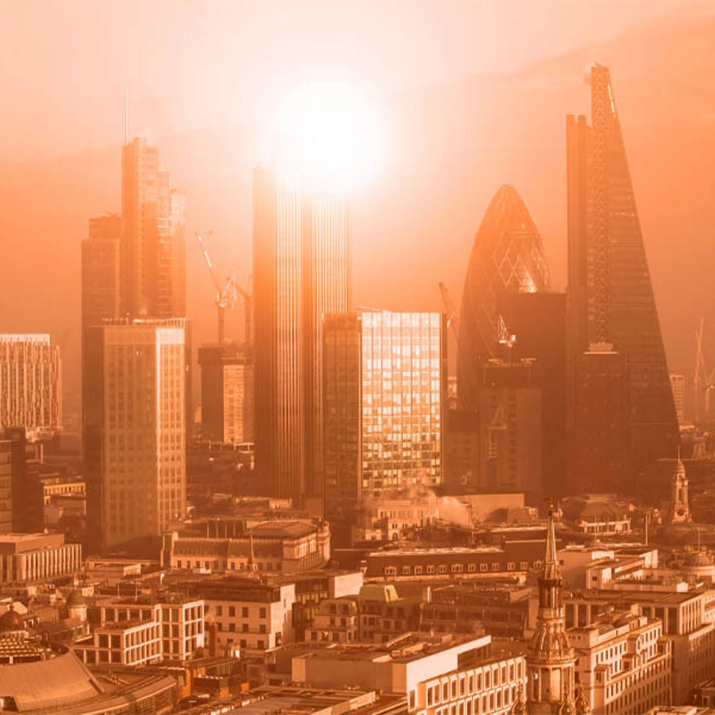 London city skyline with the sun setting