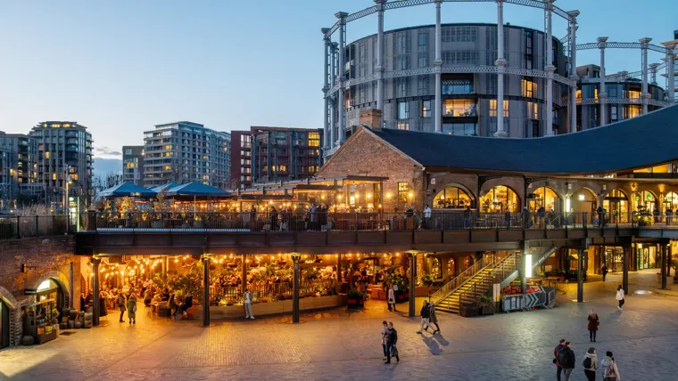 A large building with a bridge over it.