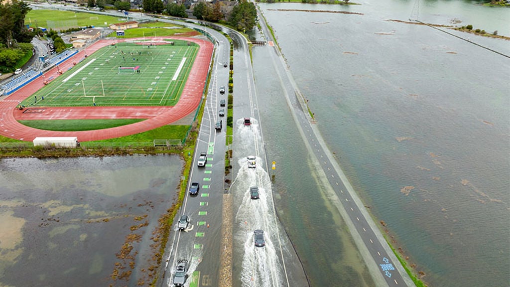 Cars driving on flooded highway in Marin County