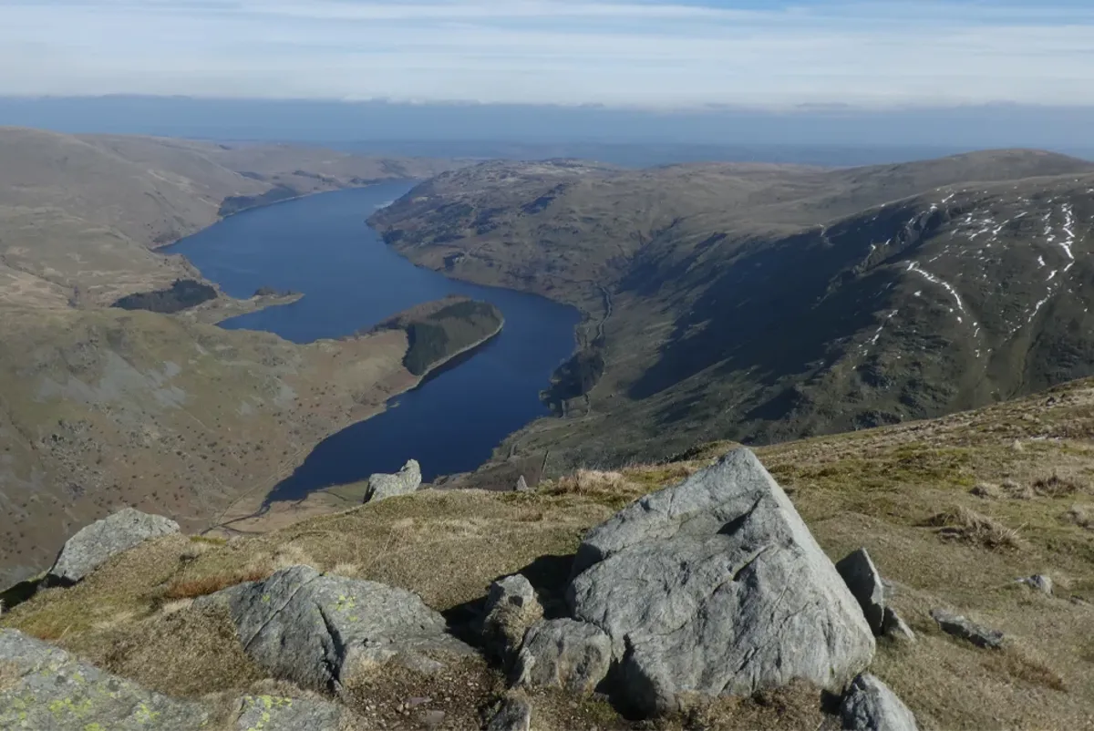 A lake surrounded by mountains.