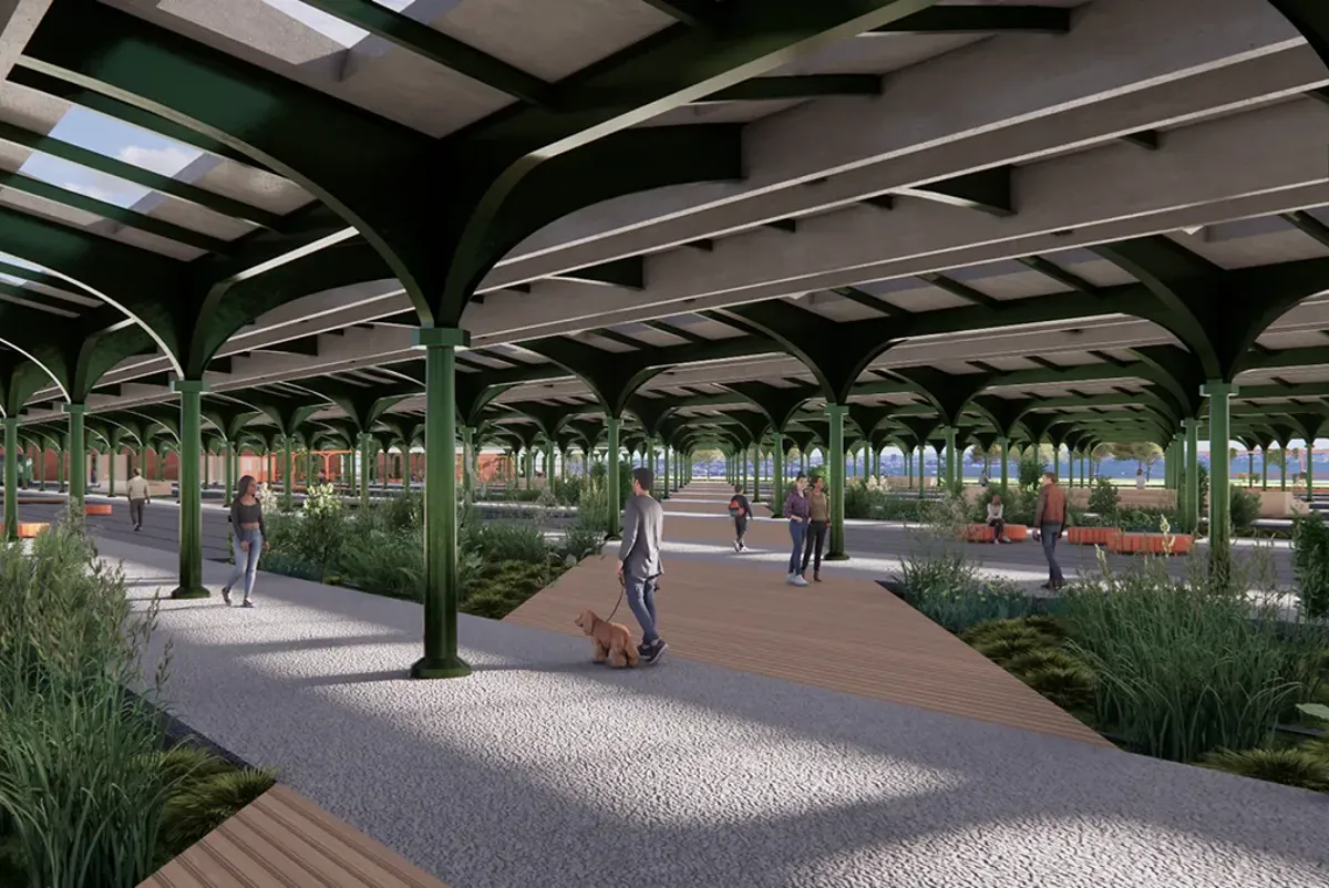 A group of people walking under a covered area.