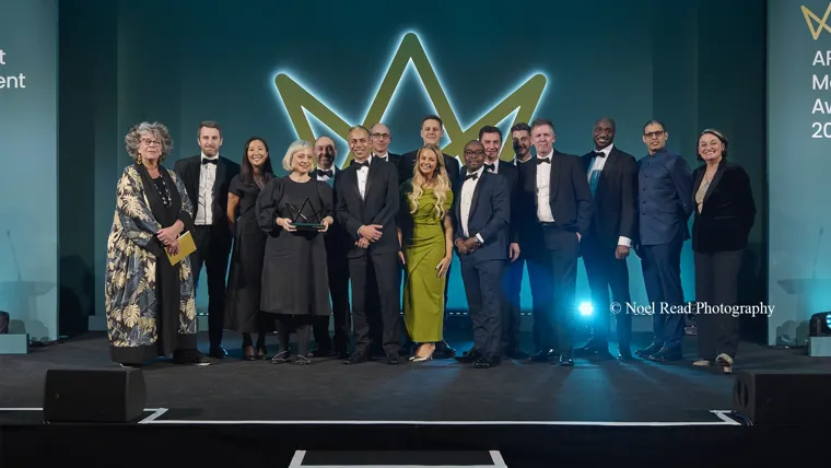 A group of people standing on a stage.