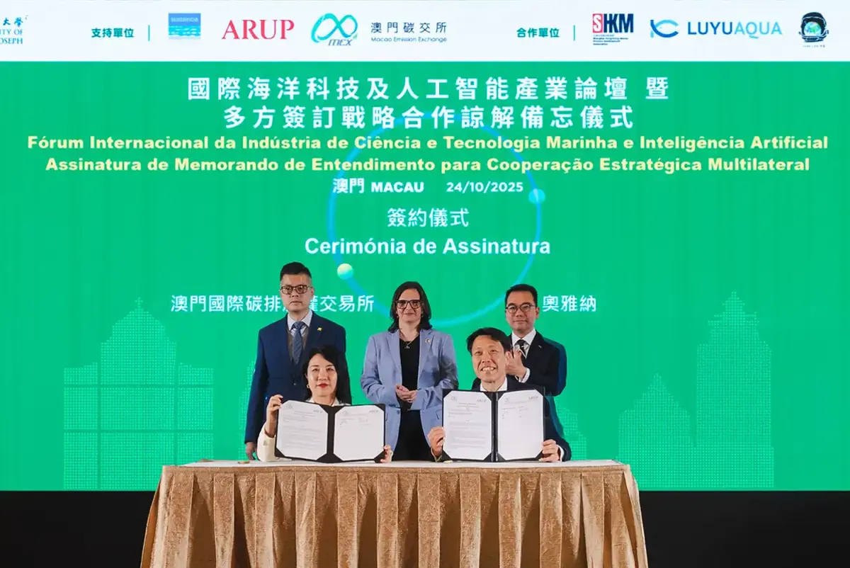 A group of people standing at a podium.