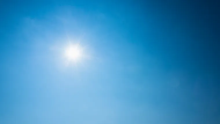 A bright sun in a blue sky.