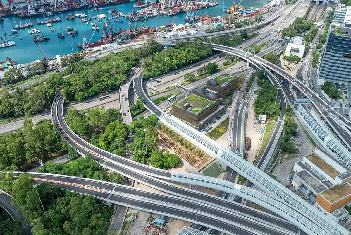 A bridge over a river with boats.