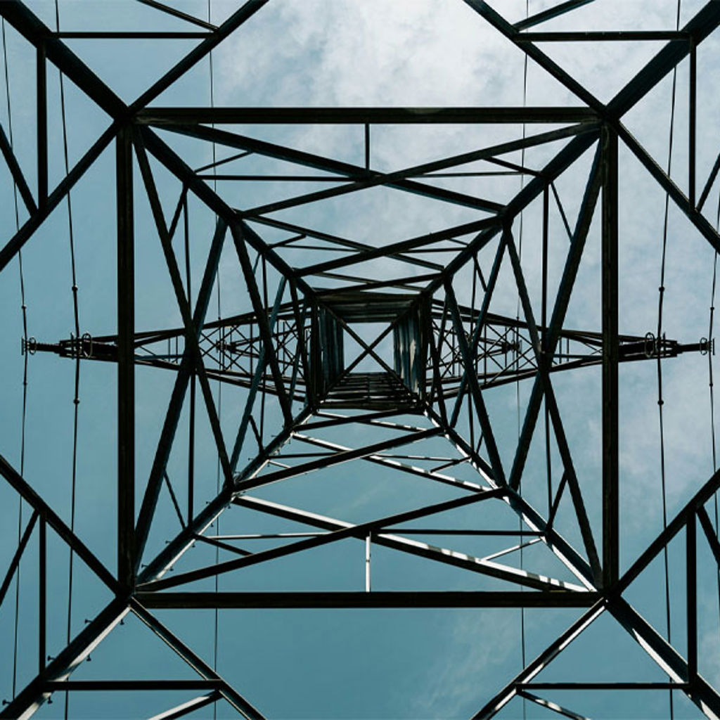 A metal tower with wires.