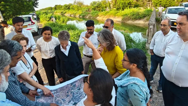 A group of people looking at a map.