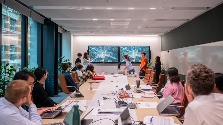 A group of people in a meeting.