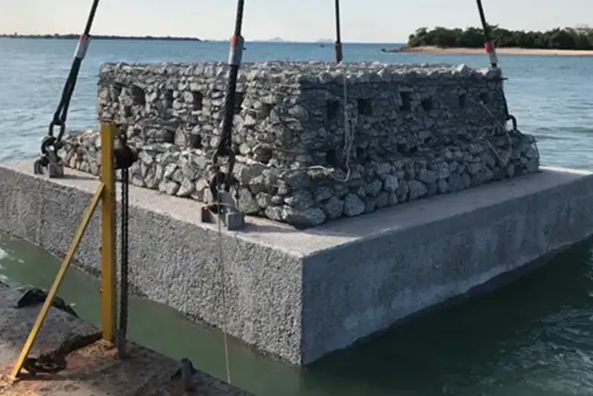 A large pile of rocks in the water.
