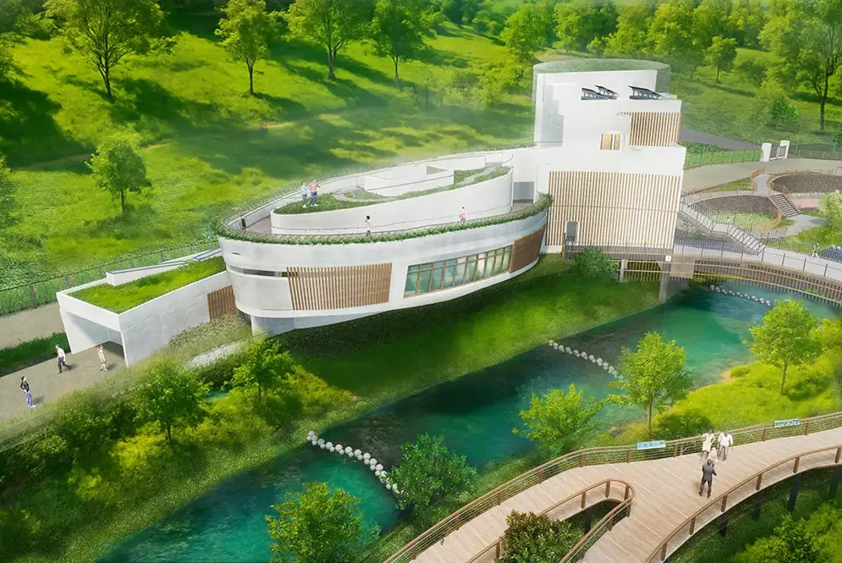 A building with a pool in front of it.