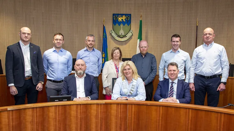 Group photo of contract signing for phases 3 and 4 of the N11/M11 bus priority interim scheme.