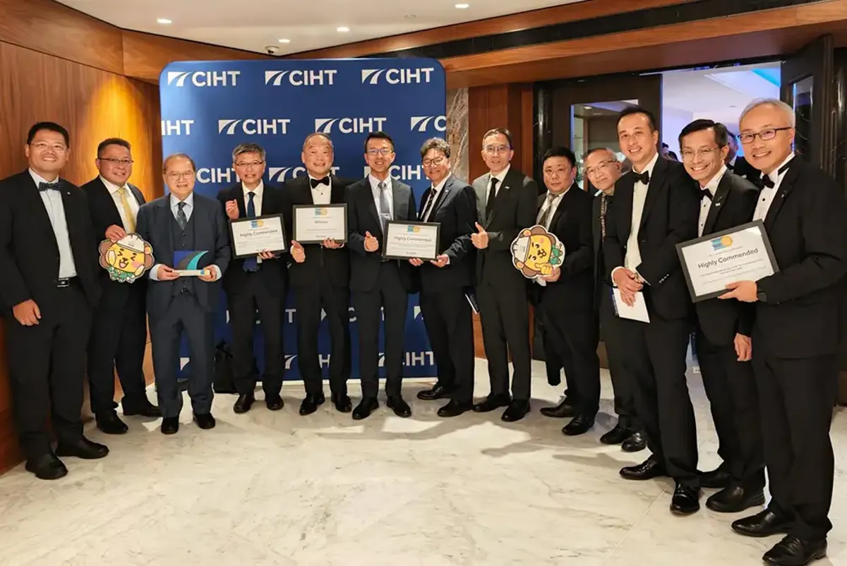 A group of people holding certificates.