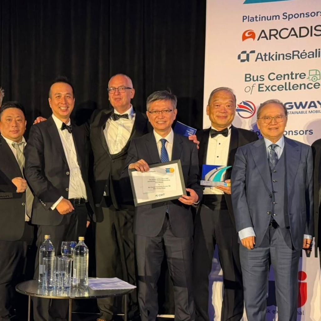 A group of men holding a certificate.