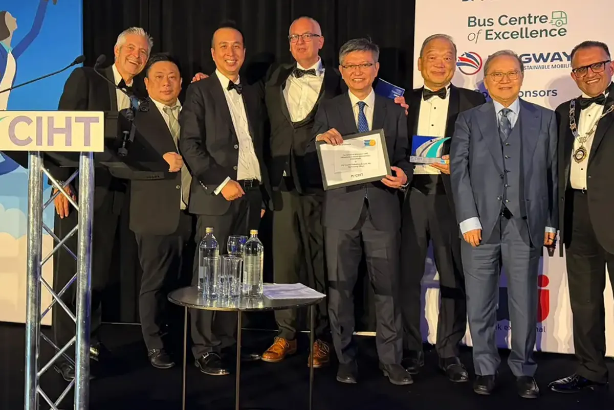 A group of men holding a certificate.