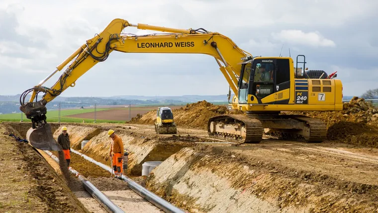 A few men working on a construction site.