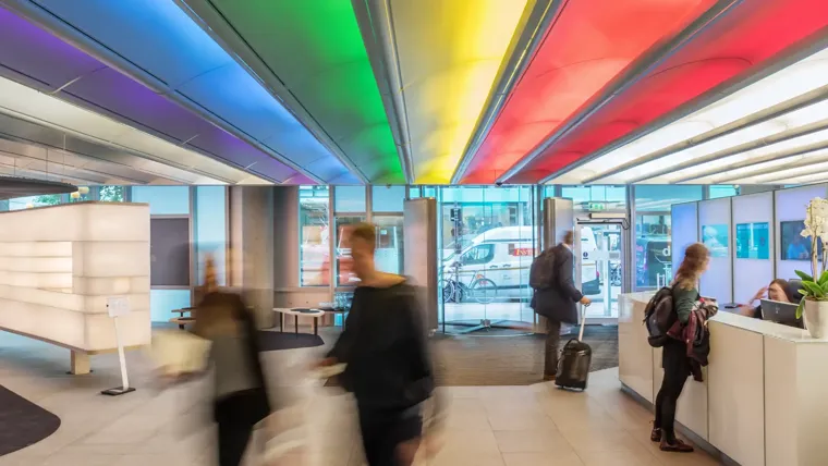 Arup office foyer with rainbow flag designed lights in ceiling