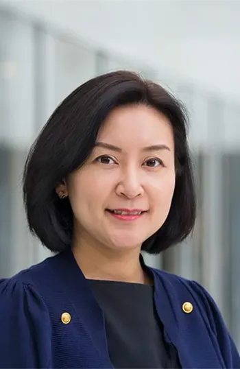 A woman in a blue shirt.