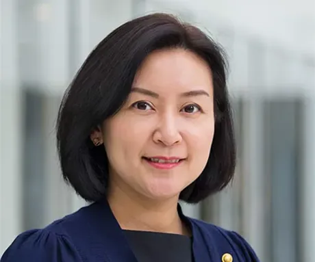 A woman in a blue shirt.