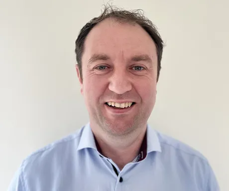 A man smiling for the camera.