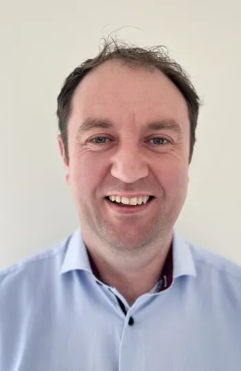 A man smiling for the camera.
