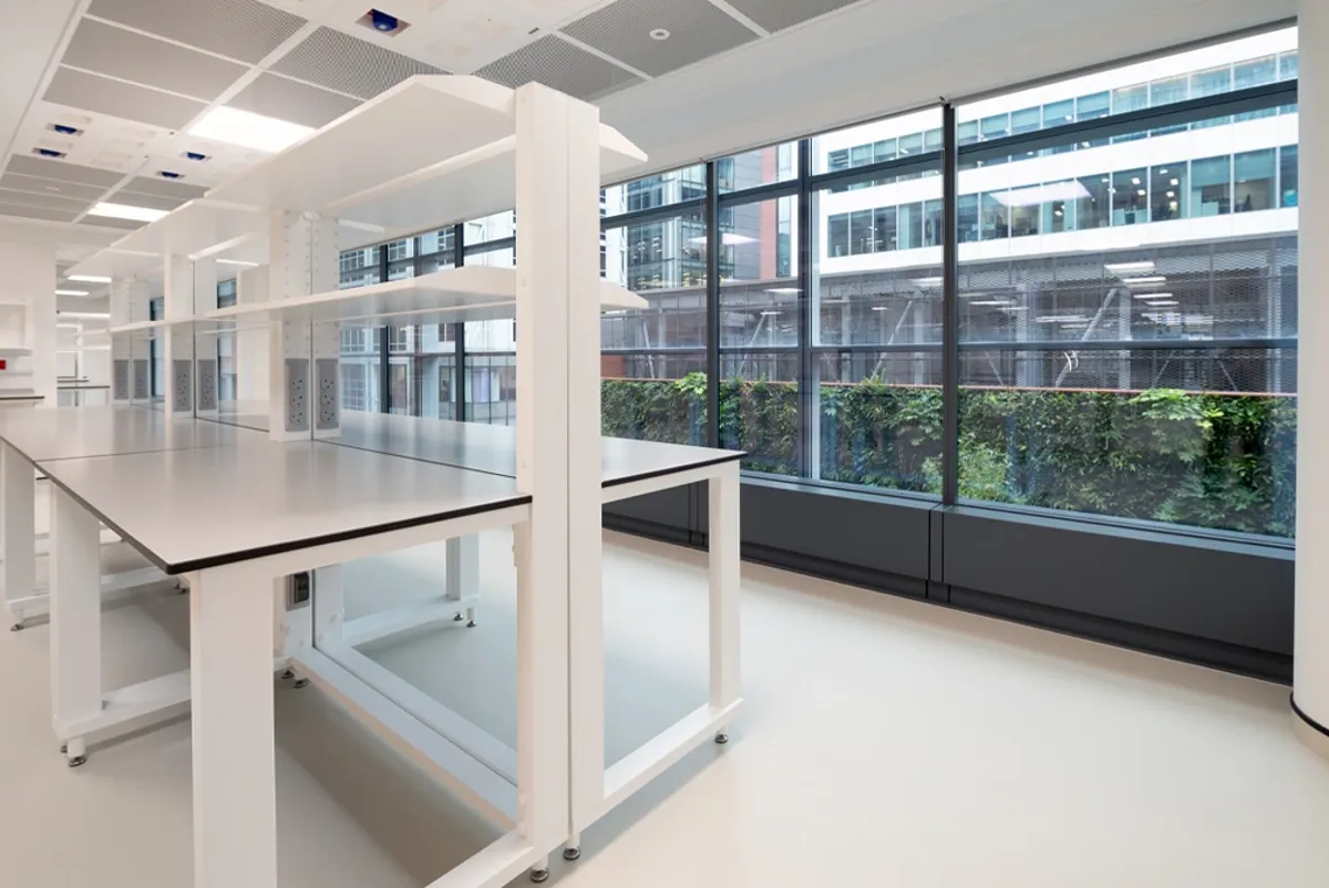 A room with a table and windows.