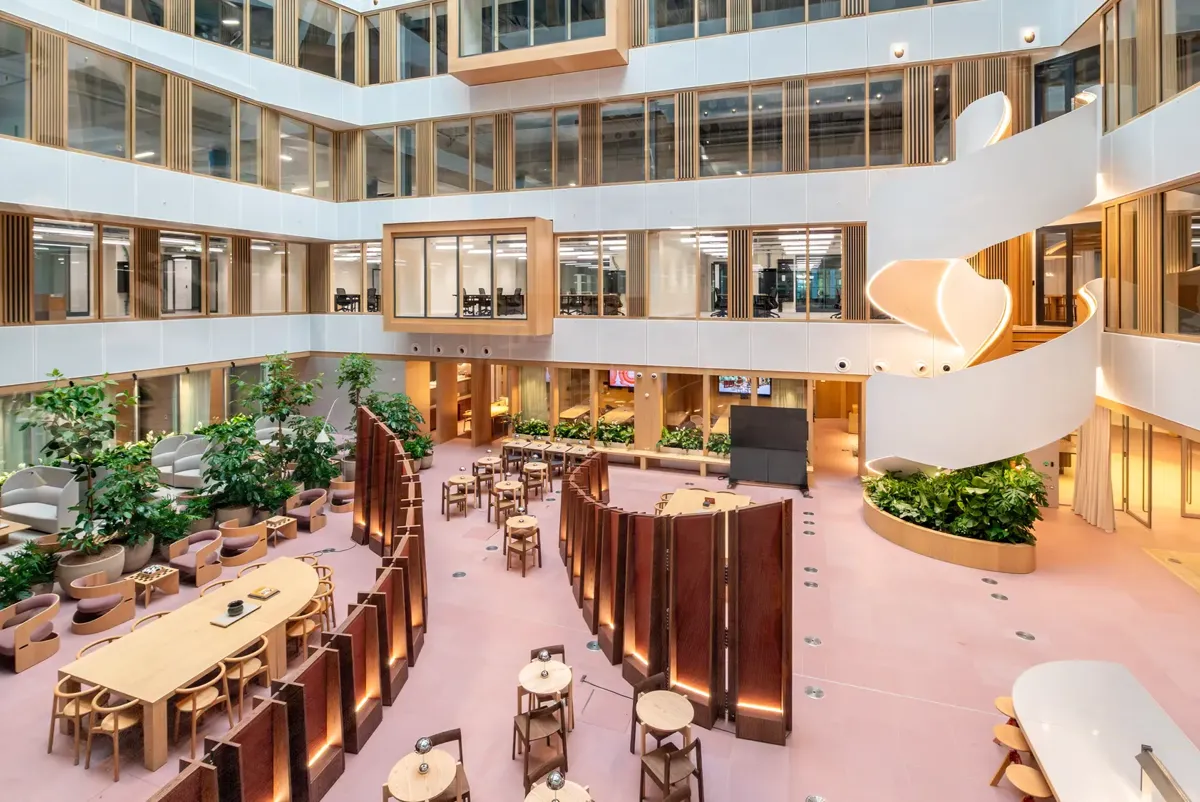 A large building with tables and chairs.