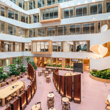 A large building with tables and chairs.