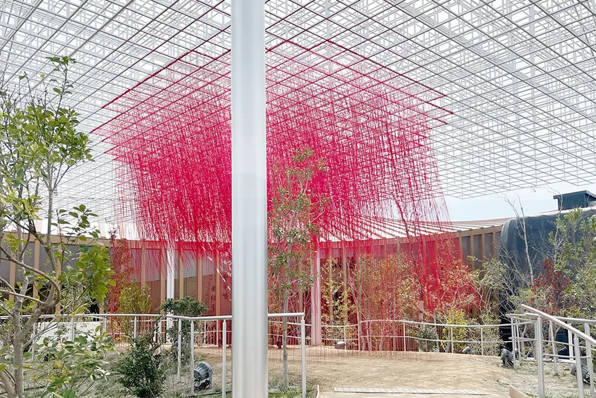 A greenhouse with a red roof.