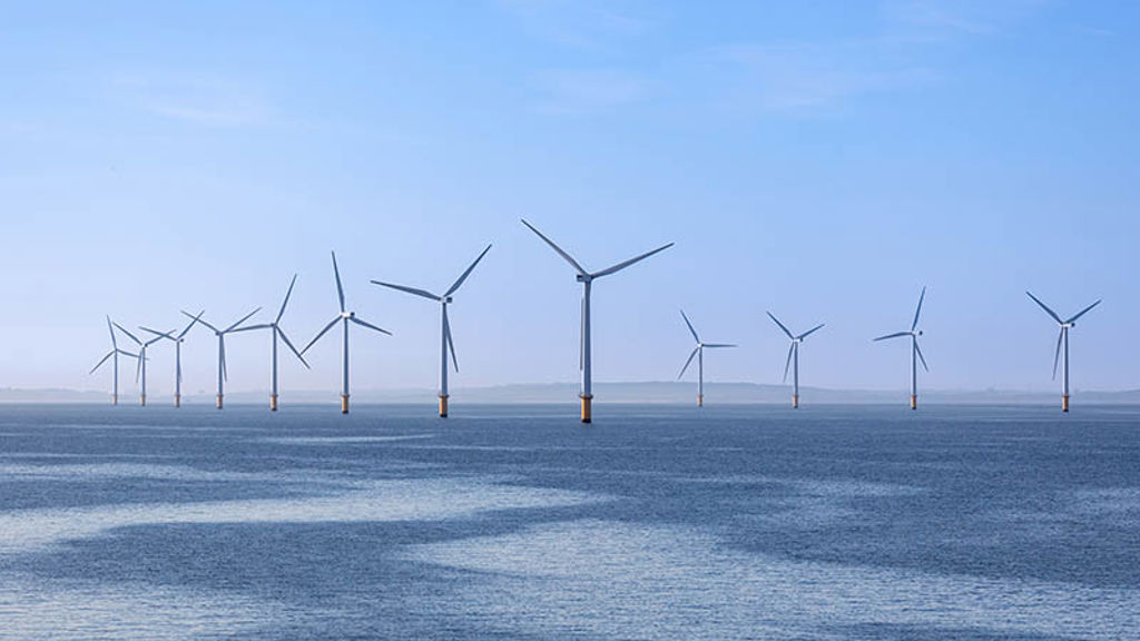 A group of wind turbines in the ocean
