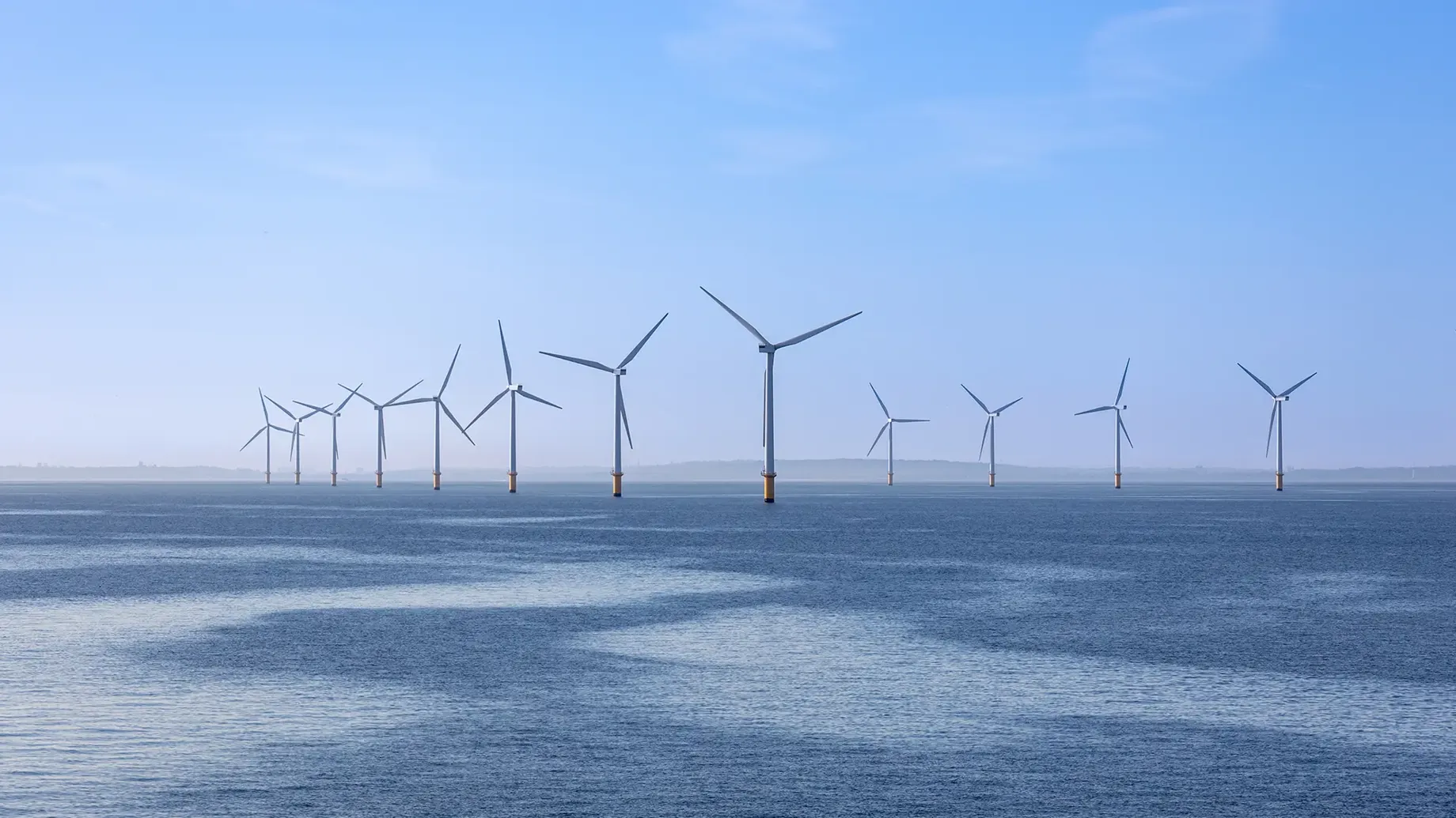 A group of wind turbines in the ocean